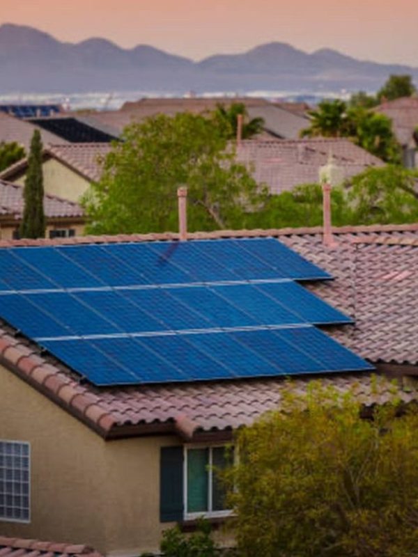 Rooftop solar panels on suburban house.