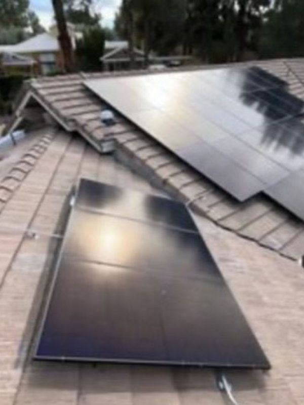 Solar panels installed on tiled roof.