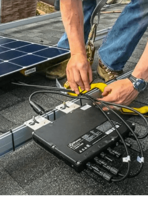 Installing solar panel on rooftop with equipment.