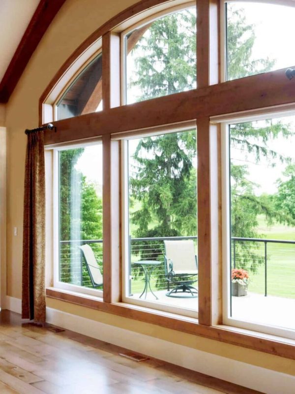 Living room with large arched windows.